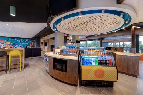 a drink station in a restaurant with a lot of drinks at Tru By Hilton Grantville, Pa in Grantville