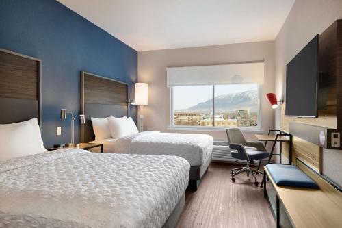 a hotel room with two beds and a window at Tru By Hilton Ogden, Ut in Ogden