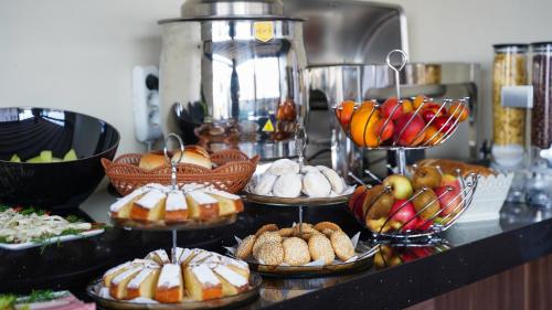a buffet with many different types of bread and pastries at Bellezza Hotel in Istanbul