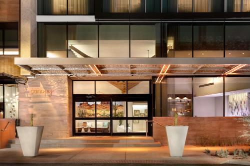 a store front of a building with glass windows at Canopy By Hilton Scottsdale Old Town in Scottsdale