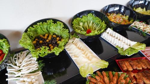 a table topped with different types of food in bowls at Bellezza Hotel in Istanbul