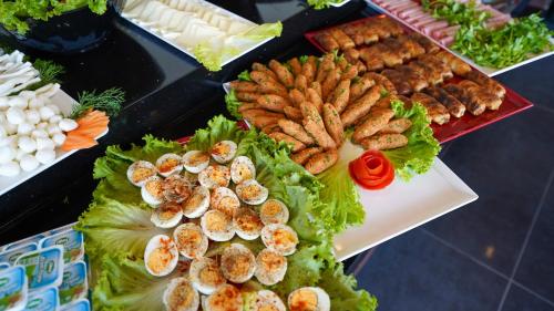 a buffet of food with shrimp lettuce and other foods at Bellezza Hotel in Istanbul