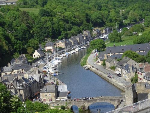 a town in the middle of a river with boats at MAHE in Plancoët