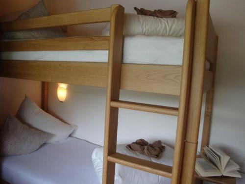 two bunk beds in a room with a bed at Apart Austria in Nauders