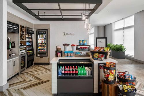 a drink station in a store with soda machines at Hilton Garden Inn Camden Waterfront Philadelphia in Camden