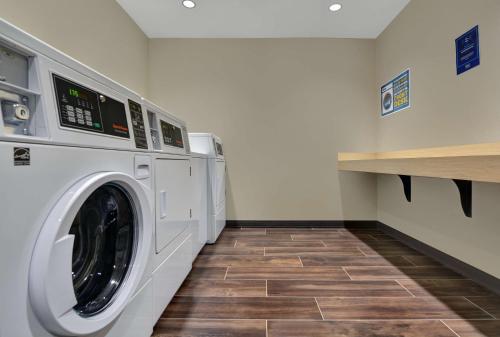 a laundry room with a washer and dryer at Home2 Suites By Hilton Largo, Fl in Largo