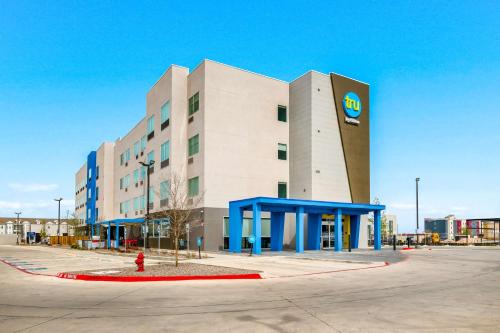 a large building with a sign on the side of it at Tru By Hilton Midland, Tx in Midland