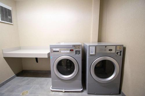 two washing machines sitting next to each other in a room at Hampton Inn North Attleboro, Ma in North Attleboro