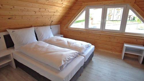 Letto o letti in una camera di Białe Domki Paula SPA Niechorze