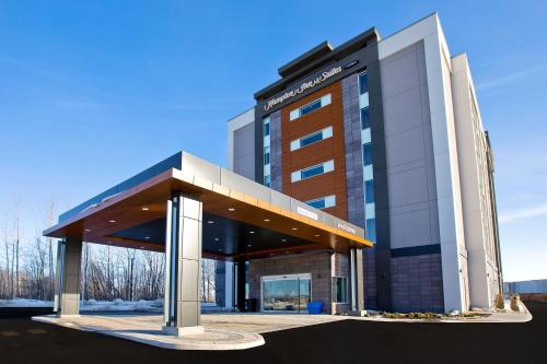 a large building with a canopy in front of it at Hampton Inn & Suites Ottawa West, Ontario, Canada in Ottawa