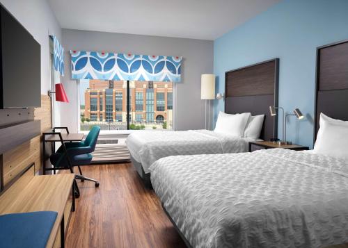 a hotel room with two beds and a window at Tru By Hilton Indianapolis Downtown, In in Indianapolis