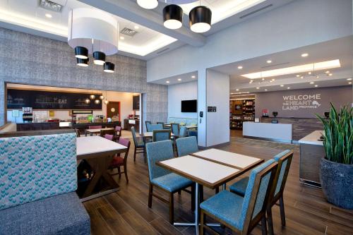 a dining room with tables and chairs in a store at Hampton Inn & Suites Ottawa West, Ontario, Canada in Ottawa