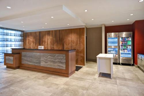 a lobby with a desk and a cash register at Homewood Suites by Hilton Tuscaloosa Downtown- Near Univ of Alabama in Tuscaloosa