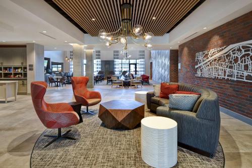 a lobby with couches and chairs and a table at Homewood Suites by Hilton Tuscaloosa Downtown- Near Univ of Alabama in Tuscaloosa