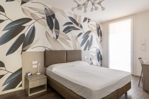 A bed or beds in a room at Citrus Apartment by Wonderful Italy
