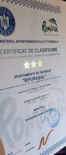 a piece of white paper with a certificate of insurance at Iepurasul Sinaia in Sinaia