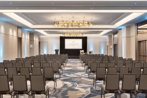 a large room with a stage and rows of chairs at Valley Hotel Homewood Birmingham - Curio Collection By Hilton in Birmingham
