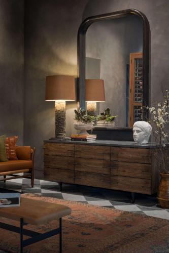 a living room with a large mirror on a dresser at Valley Hotel Homewood Birmingham - Curio Collection By Hilton in Birmingham