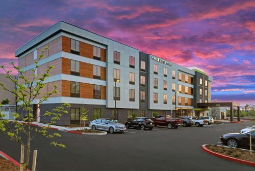 a rendering of a hotel with cars parked in a parking lot at Home2 Suites By Hilton Salem in Salem