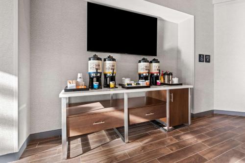 a table with several bottles of alcohol on it in a room at Hampton Inn & Suites Tigard in Tigard