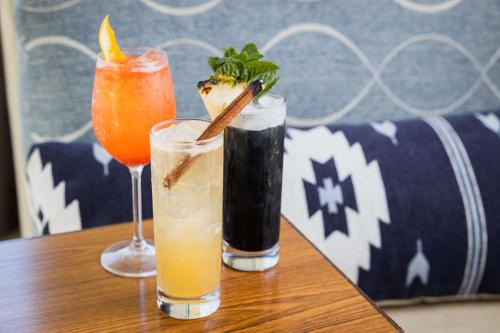two cocktails sitting on a table on a table at Redondo Beach Hotel, Tapestry Collection by Hilton in Redondo Beach
