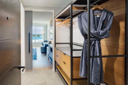 a bedroom with a bunk bed and a closet at Canopy By Hilton Portland Waterfront in Portland