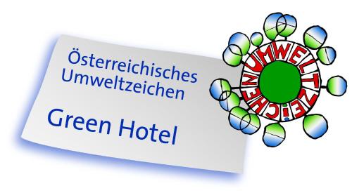 a sign with the wordsustainable unplugged green hotel at TUI BLUE Schladming in Schladming