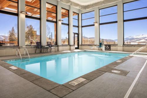 a swimming pool in a building with windows at Homewood Suites By Hilton Dillon in Dillon