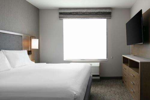a bedroom with a large white bed and a window at Homewood Suites By Hilton Dillon in Dillon