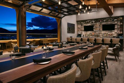 a large dining room with a long table and chairs at Homewood Suites By Hilton Dillon in Dillon