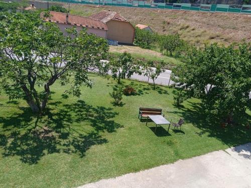 an overhead view of a park with a bench and trees at Vila Natalija in Podgorica