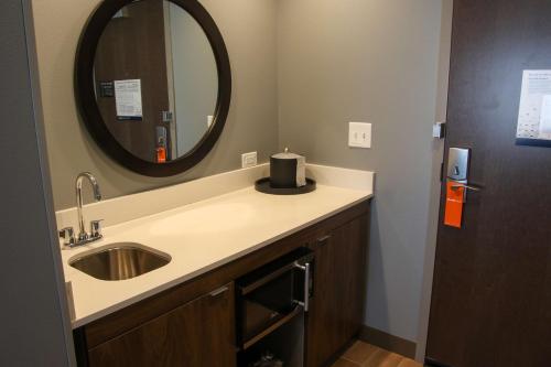 a bathroom with a sink and a mirror at Hampton Inn & Suites Olean, Ny in Olean