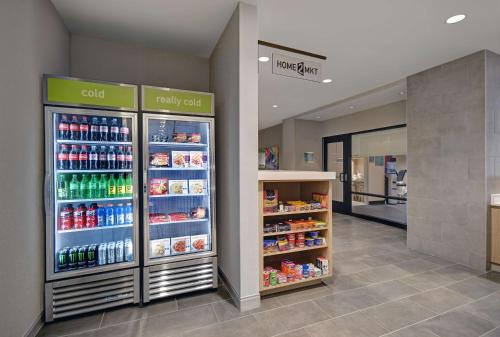 a store with a refrigerator filled with lots of drinks at Home2 Suites by Hilton Blacksburg University in Blacksburg