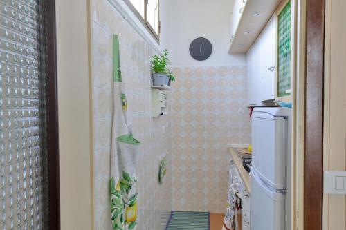 a kitchen with a wall with plants on it at Riviera dei friori in Bordighera