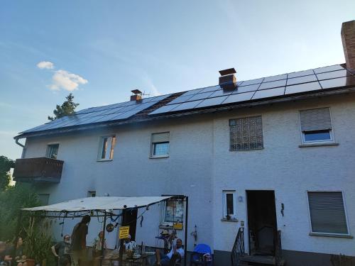 a house with solar panels on top of it at Gästehaus Nachtigall 2 in Gädheim