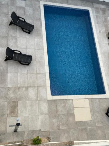 an overhead view of a swimming pool in a building at villa Ana in Preko