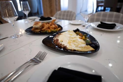 a table with a plate of food on a table at Doubletree Sulphur Lake Charles in Sulphur