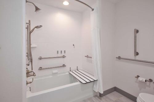a white bathroom with a tub and a shower at Hilton Garden Inn Columbus Easton, Oh in Columbus
