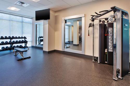 a fitness room with a gym with a mirror at Hilton Garden Inn Columbus Easton, Oh in Columbus
