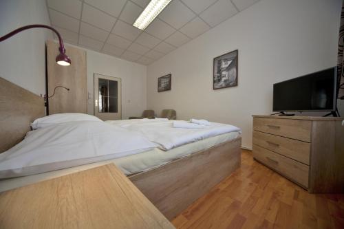 Letto o letti in una camera di U Heligonky