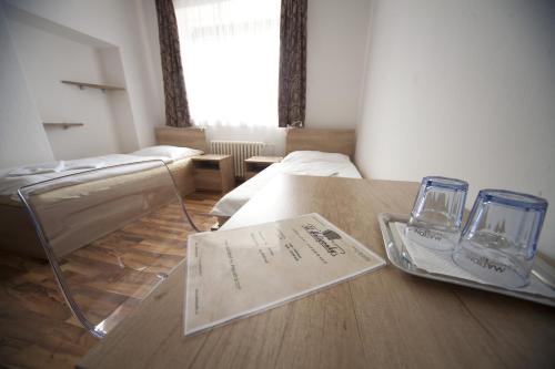 Letto o letti in una camera di U Heligonky