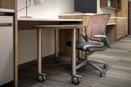 an office cubicle with a desk and a chair at Home2 Suites By Hilton Kenner New Orleans Arpt in Kenner