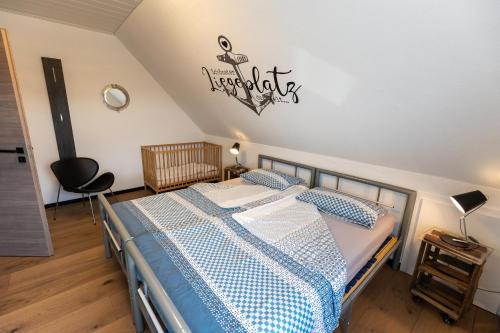 a bedroom with a bed and a sign on the wall at Koch 2 in Dahme