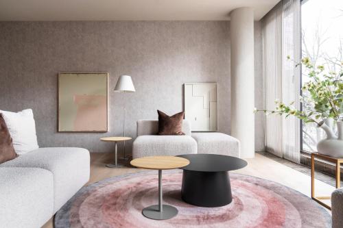 a living room with a couch and a table at 348 Suites Short Stay in The Hague