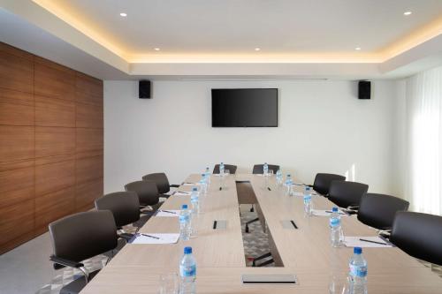 a large conference room with a long table and chairs at Hampton By Hilton Tashkent in Tashkent