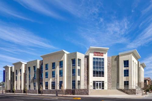 a large white building on the side of a street at Hilton Garden Inn Temecula in Temecula