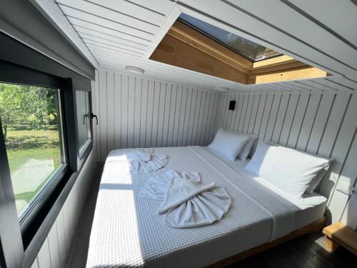 Postel nebo postele na pokoji v ubytování Grenadine Lodge