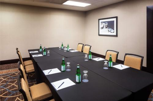 a meeting room with a long table with green bottles at DoubleTree by Hilton Silver Spring Washington DC North in Silver Spring