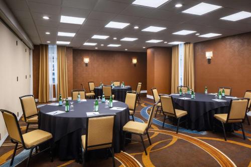 a conference room with tables and chairs in it at DoubleTree by Hilton Silver Spring Washington DC North in Silver Spring