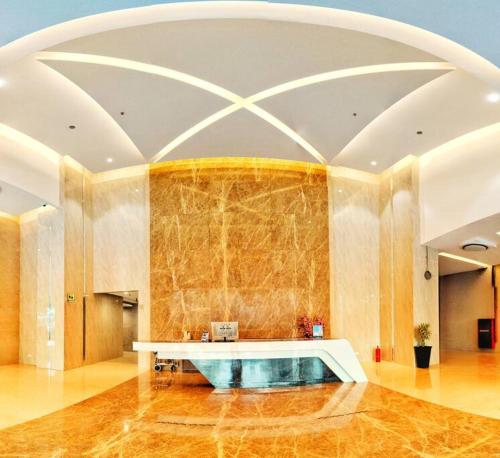 a large lobby with a table in the middle of a room at Lovina 20-12A Formosa Residence in Nagoya